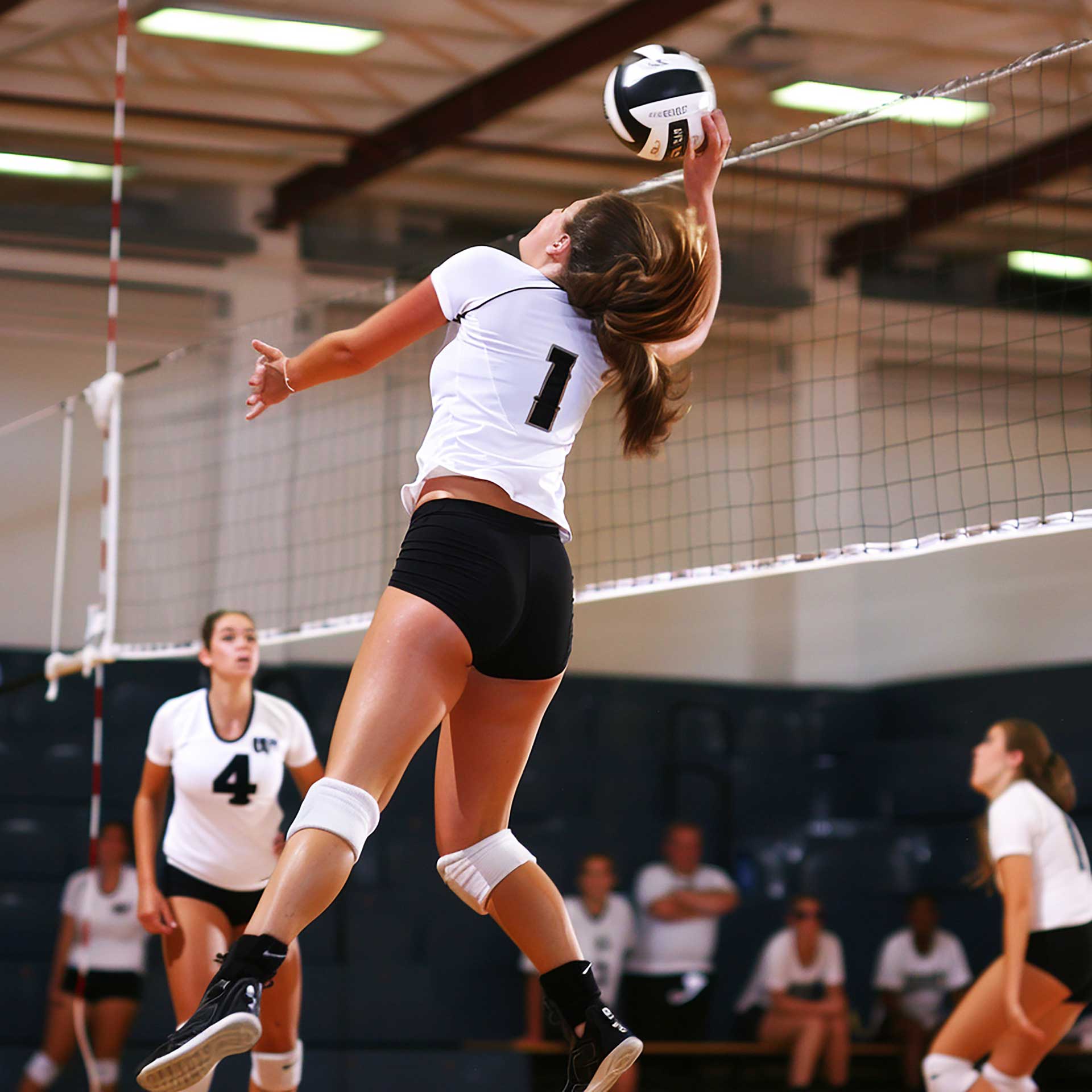 Marvel at the mountain majesty as a climber stands against the backdrop of snow-capped peaks. This image portrays the beauty of alpine scenery and the formidable challenge of climbing in cold, high-altitude environments.