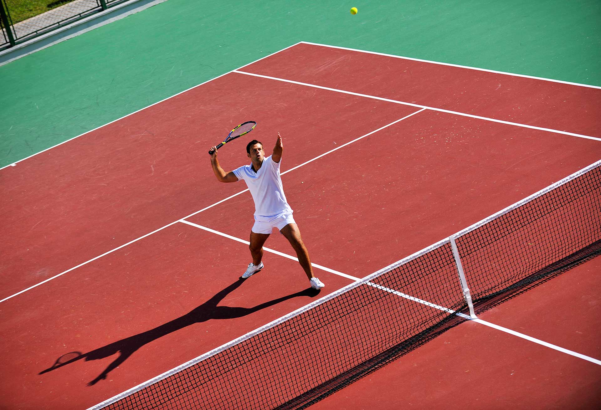 Shot of two young chefs in the kitchen preparing food